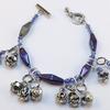 Antique Silver Heart Clasp.  Silver filigree bead caps and links enhance the faceted iridescent Silver and Twilight Purple beads.  Beautiful CZECH glass beads shimmer with shades of majestic purple and deep ocean blue,  Bracelet is approximately 7" bead to bead.