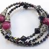 Memory bracelet with Plum Marble Style acrylic beads.  Tibetan antique silver Bali bead caps and beads.  Black iridescent bicone beads.  Bracelet measures approx. 2 1/2" wide.