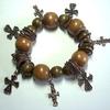 Great wooden bead stretch  bracelet with Antique Brass Rings and varied cross charms.  Approximately 7 to 7 1/2" 
