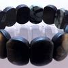 Black Jasper Gemstone Stretch Bracelet is 7 1/2"   Approximately 3/4" wide.  The Gemstones are a very pleasant soft matte, but not lacking in polish.