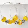 Antique Silver Tone Yellow Pandora Glass Hoop Clip-back Earrings. Lead Compliant Approx. 1 1/2" in diameter. A truly nice style summer touch earring. 776/320