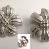 Sassy Little Silver Flower Earrings.  Clip-on style.  Approximately 1 1/2" wide.