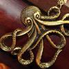 Octopus Necklace finished in Antique Brass Style.  Chain is antique brass finish approximately 27"/28" long with lobster clasp.  Octopus pendant is approximately 2" wide x 1 3/4' long.  Lead compliant.