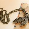 Antique chain is approx. 14" long, 27" long total. Dragonfly Pendant is approx. 2 3/4" wide x 1 1/2" long. 