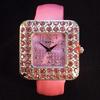 Pink Rhinestone Encrusted Watch by Geneva.  Leather Pearl Pink Bracelet style cuff.  Watch face is slightly 1 1/2" wide.   Comes in a black watch box.