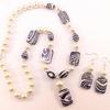 Zebra striped beads, crystal rings, and pearls enhance this necklace and earring set.  The zebra stripes look almost black and white, HOWEVER, they are a deep purple. They are lovely.  The earring pendants are approximately 1 1/2" long.  Necklace is approx. 18 - 20" long.