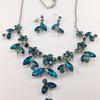 Blue Rhinestone Gems Necklace and Earrings.  Necklace, when laid flat, measures approx. 10"  from clasp to bottom.
Circumference, minus charm, is approx. 16" - 18"   Extension is approx. 2" long.   Earrings from top to bottom are approx. 1 1/8" long.